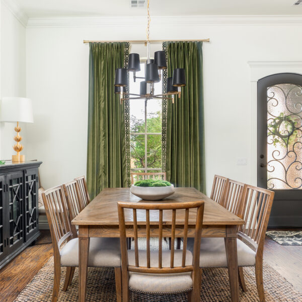 Dining room with high quality earthy green curtains and wooden table, cozy and inviting ambiance.