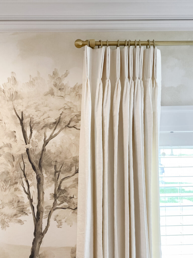 Tree motif on white curtain, creating a serene and natural ambiance in the space.